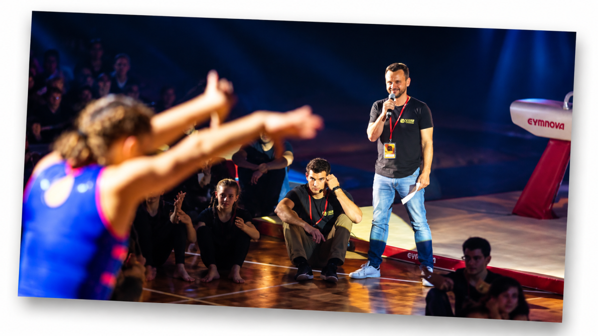 Finale of the Natalis Show in 2017, featuring a gymnast in the foreground and Yves Depallens holding a microphone during the 150th anniversary celebrations of Montreux Gymnastique.