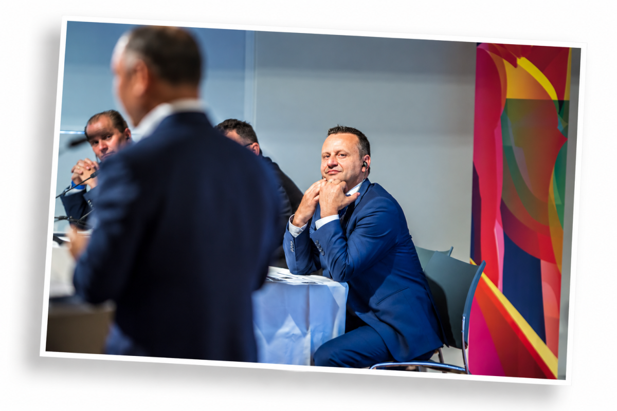 Yves Depallens, wearing a blue suit, attending a professional meeting, reflecting his experience in business development and international business relationships.