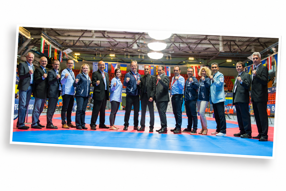 Group photograph of the organising committee and partners on the competition mats at the 2016 European Taekwondo Championships in Montreux, illustrating teamwork and collective commitment to an international sporting event.